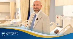 Dr. Andrew Nydegger, Dean of Westcliff University&rsquo;s College of Nursing, speaking with nursing students at the Corona campus simulation lab.