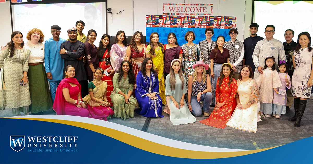 Group of Westcliff Students and Employeees posting in cultural attire at the International Food and Culture Festival