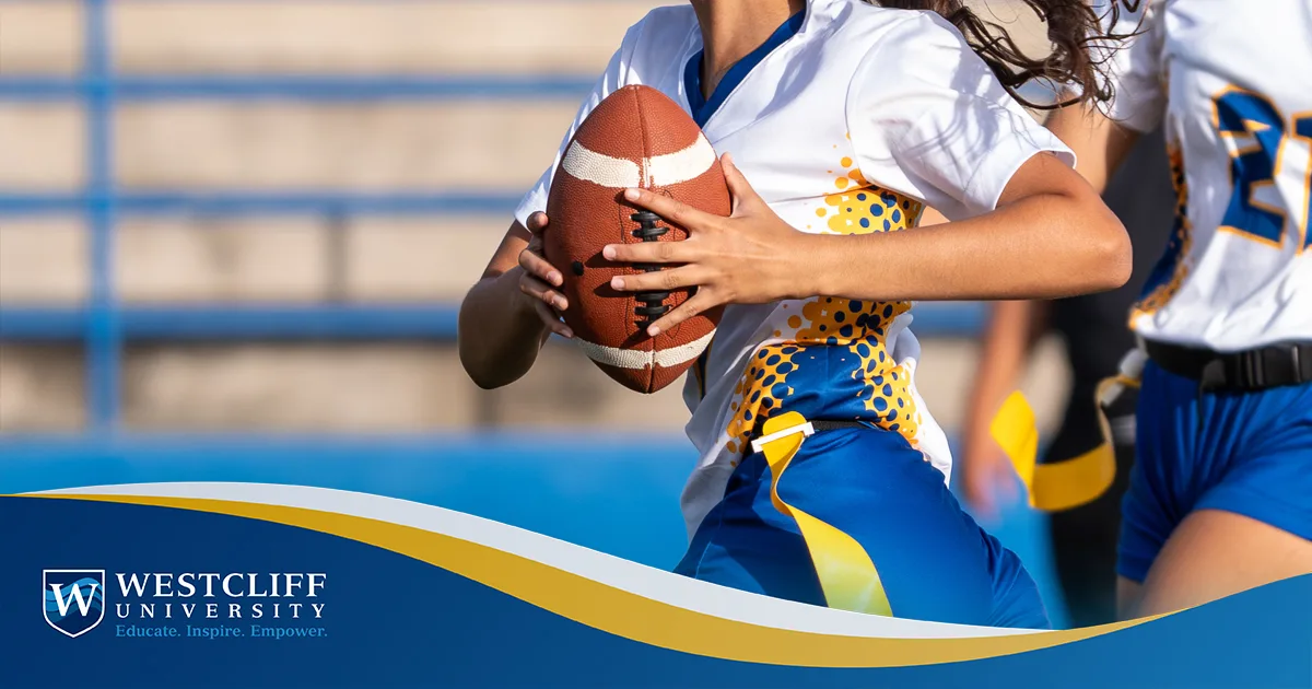 Female flag football player holding a football running