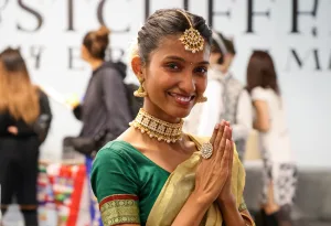 Read October 2026 Newsletter International Food and Culture Festival. Female Wearing Cultural Attire.